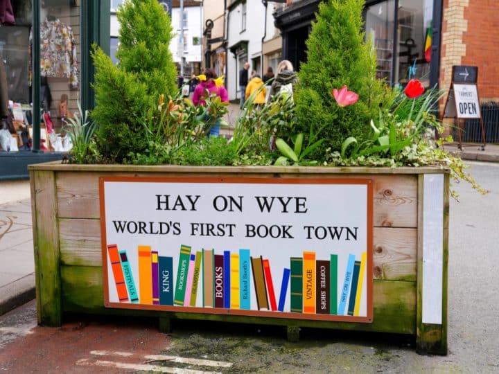 Sign on a planter says Hay On Wye World's First Book Town Hay Festival Airbnb