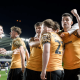 Hull City AFC players hug one another in celebration on the pitch