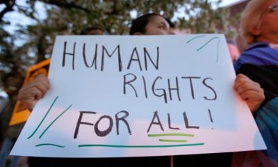 Protest placard reading Human Rights For All