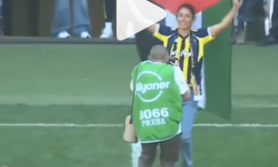 Ipek Kaya celebrates the Turkish Women's Football League title dancing on to the pitch, holding the Palestine flag above her head