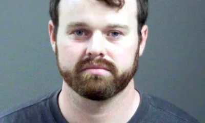 Joseph Duggar booking photo, a married father-of-four and the younger brother of convicted sex offender Josh Duggar was arrested on Wednesday in connection with allegations that he touched a nine-year-old girl on her underwear and genitals.
