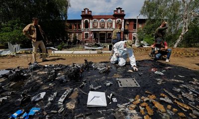 Forensic experts sift through ruined dormitory in Russian-held Luhansk region