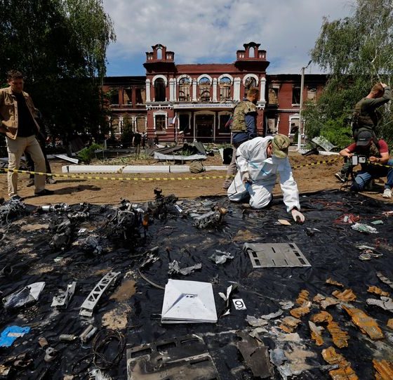Forensic experts sift through ruined dormitory in Russian-held Luhansk region