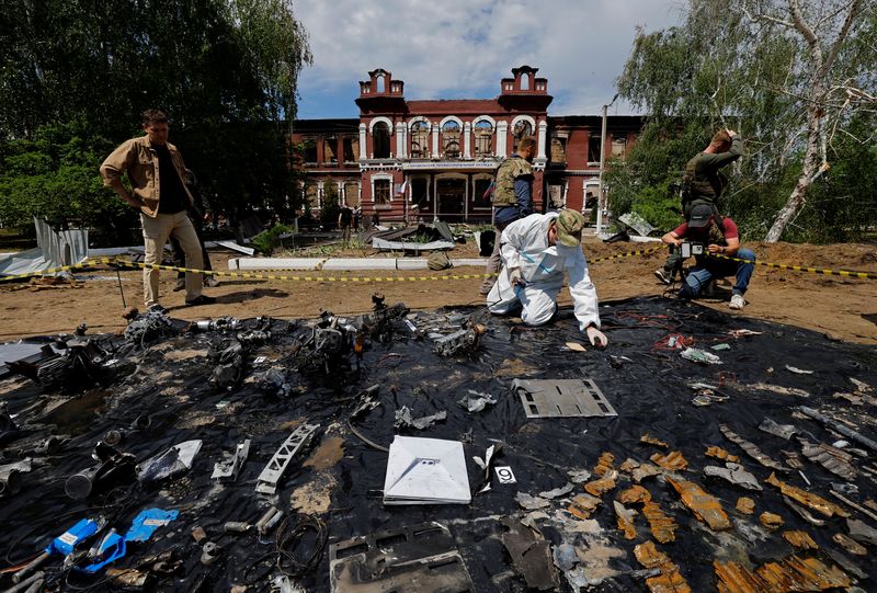 Forensic experts sift through ruined dormitory in Russian-held Luhansk region