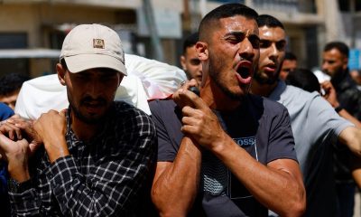 Palestinians mourn slain Hamas militant chief as Israel escalates Gaza attacks