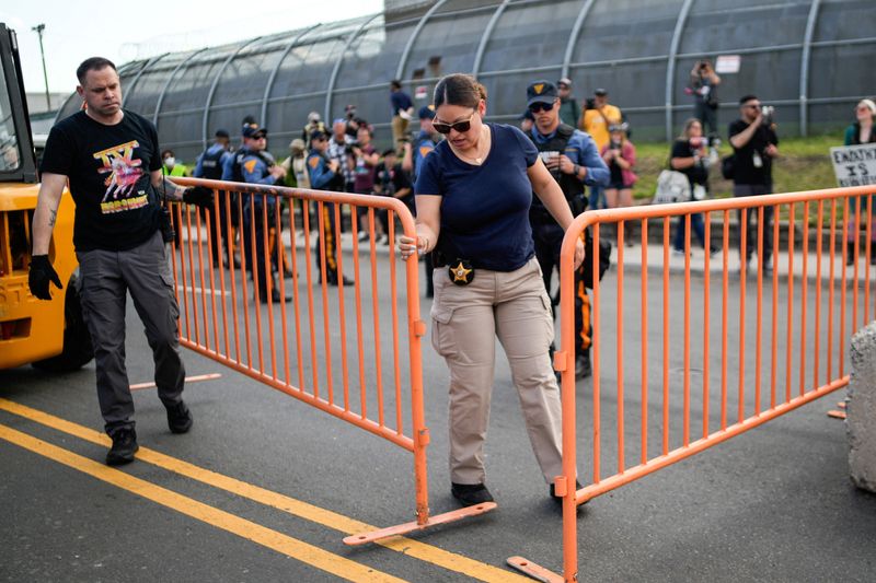 New Jersey state police assert control outside migrant detention center