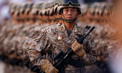 Japan refutes ’new militarism’, accuses China of rapidly arming
