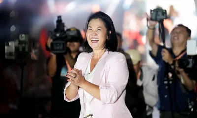 Right-wing Fujimori holds narrow lead one week before Peru presidential runoff, polls show