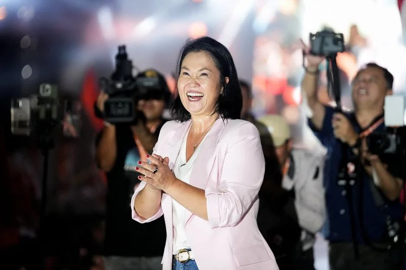 Right-wing Fujimori holds narrow lead one week before Peru presidential runoff, polls show