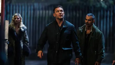 Tom Hardy walks with purpose in MobLand.
