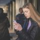 A girl looks at a mobile phone Online misogyny Barnardo's