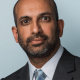 A corporate head shot of Palestine Action barrister, Rajiv Menon