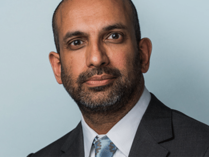 A corporate head shot of Palestine Action barrister, Rajiv Menon
