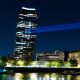 Projection onto Millbank Tower reading Resist Reform