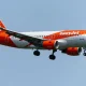 EasyJet flight to London diverts mid-air after passenger left phone charging in luggage | News UK