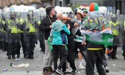 Celtic fans pelt riot police with bottles as fights break out in Glasgow | Football