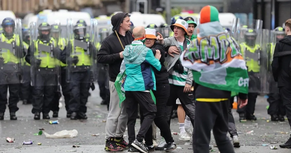 Celtic fans pelt riot police with bottles as fights break out in Glasgow | Football
