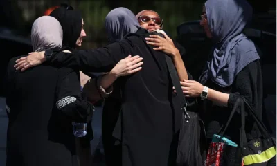 Female Muslim mosque members embrace in the parking lot of the Islamic Center of San Diego (ICSD) on May 19, 2026 in San Diego, California.
