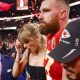 Taylor Swift embraces beau Travis Kelce after the Kansas City Chiefs win the super bowl beating the San Francisco 49ers 25-22.