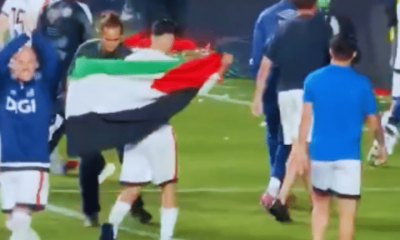 Akhomach celebrates with the Palestinian flag after his team Rayo Vallecano’s win over Strasbourg