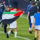 Akhomach celebrates with the Palestinian flag after his team Rayo Vallecano’s win over Strasbourg