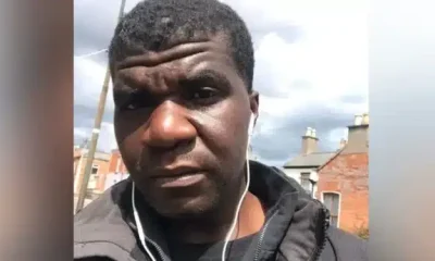 Selfie image of Yves Sakila with ear phone wires hanging from his ears