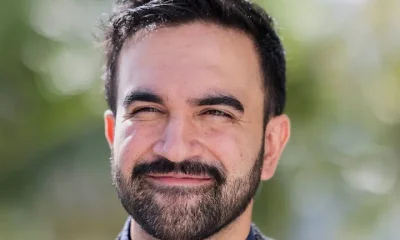 A sunny head shot of Zohran Mamdani