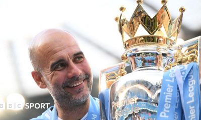 Pep Guardiola holds up six fingers to fans to indicate the six Premier League titles won after their match with Liverpool in December 2024