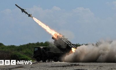 Japan's defence minister denies militarism and criticises China's 'huge arsenal'