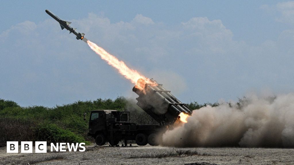 Japan's defence minister denies militarism and criticises China's 'huge arsenal'