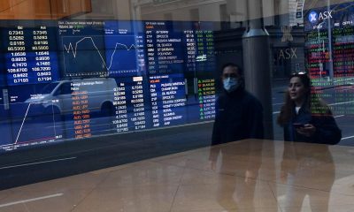 Australian shares end volatile week on positive note