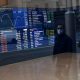 Australian shares end volatile week on positive note