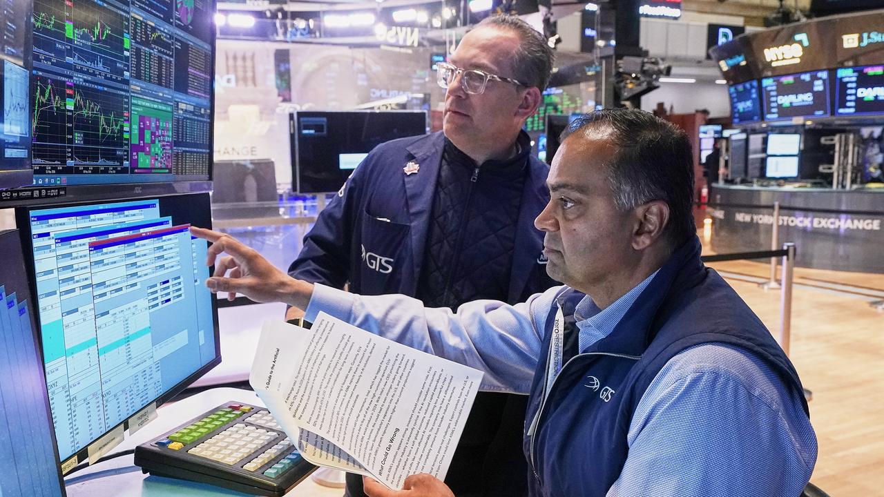 Wall St ends slightly higher as investors watch Iran