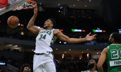 Back in action: Milwaukee's Giannis Antetokounmpo scores in the Bucks' come-from-behind NBA victory over the Boston Celtics