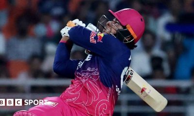 Vaibhav Sooryavanshi holding a cricket bat over his shoulder