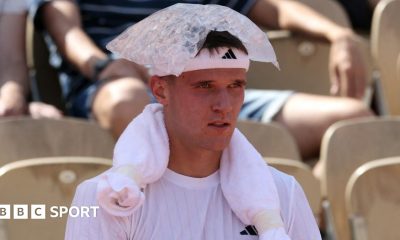 Jakub Mensik sits with an ice pack on his head during his first-round match at the French Open