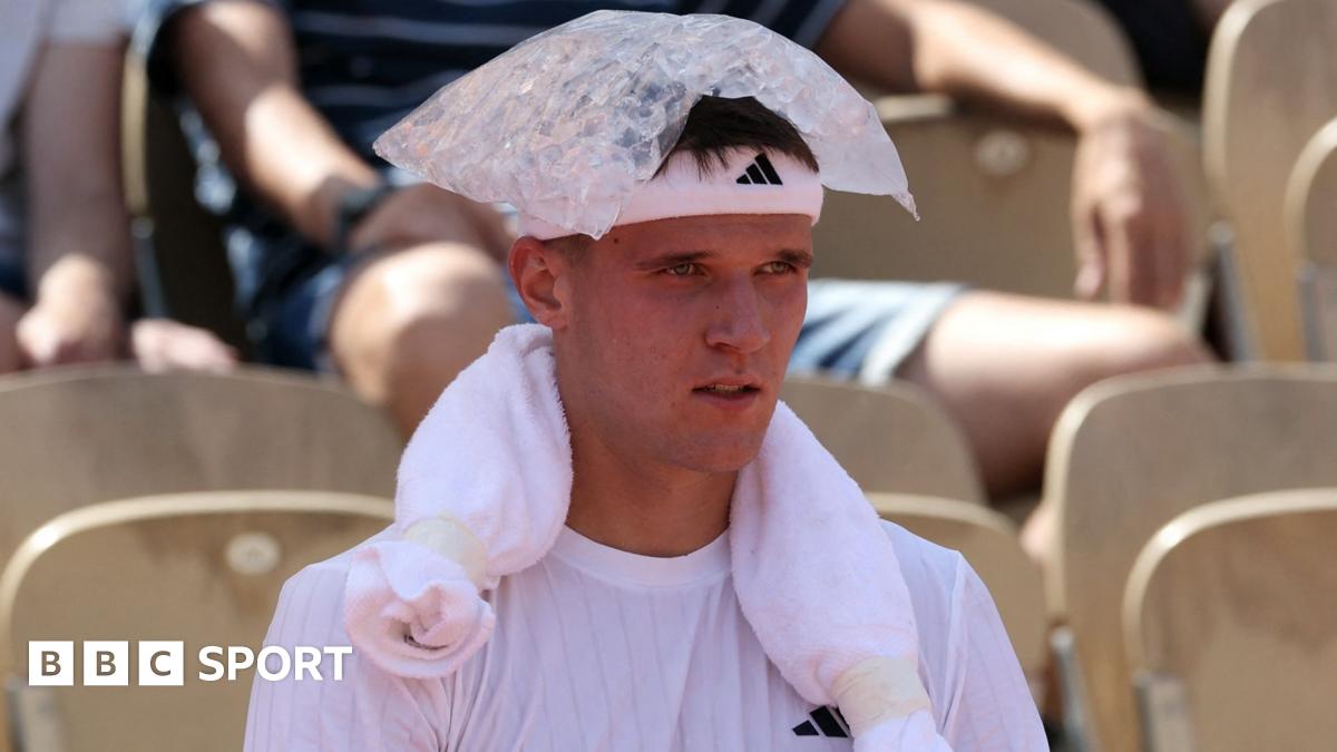 Jakub Mensik sits with an ice pack on his head during his first-round match at the French Open