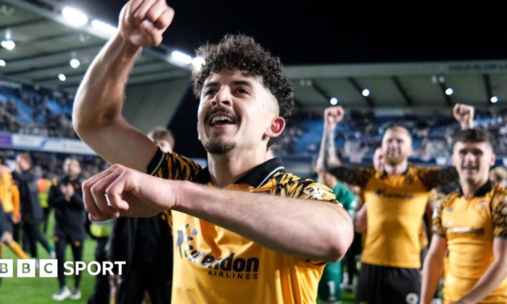Hull City winger Mohamed Belloumi celebrates in front of his team-mates after their 2-0 win at Millwall