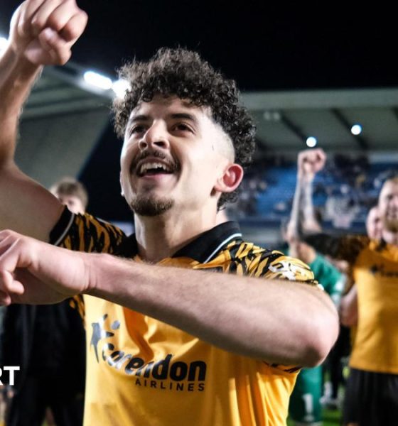 Hull City winger Mohamed Belloumi celebrates in front of his team-mates after their 2-0 win at Millwall