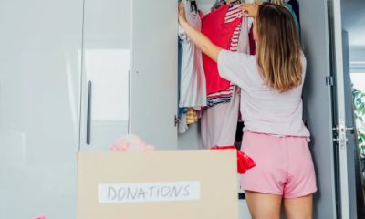 woman wears casual shorts and t-shirt while doing a closet purge and hoping she doesn't have regrets about getting rid of her workwear