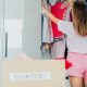 woman wears casual shorts and t-shirt while doing a closet purge and hoping she doesn't have regrets about getting rid of her workwear