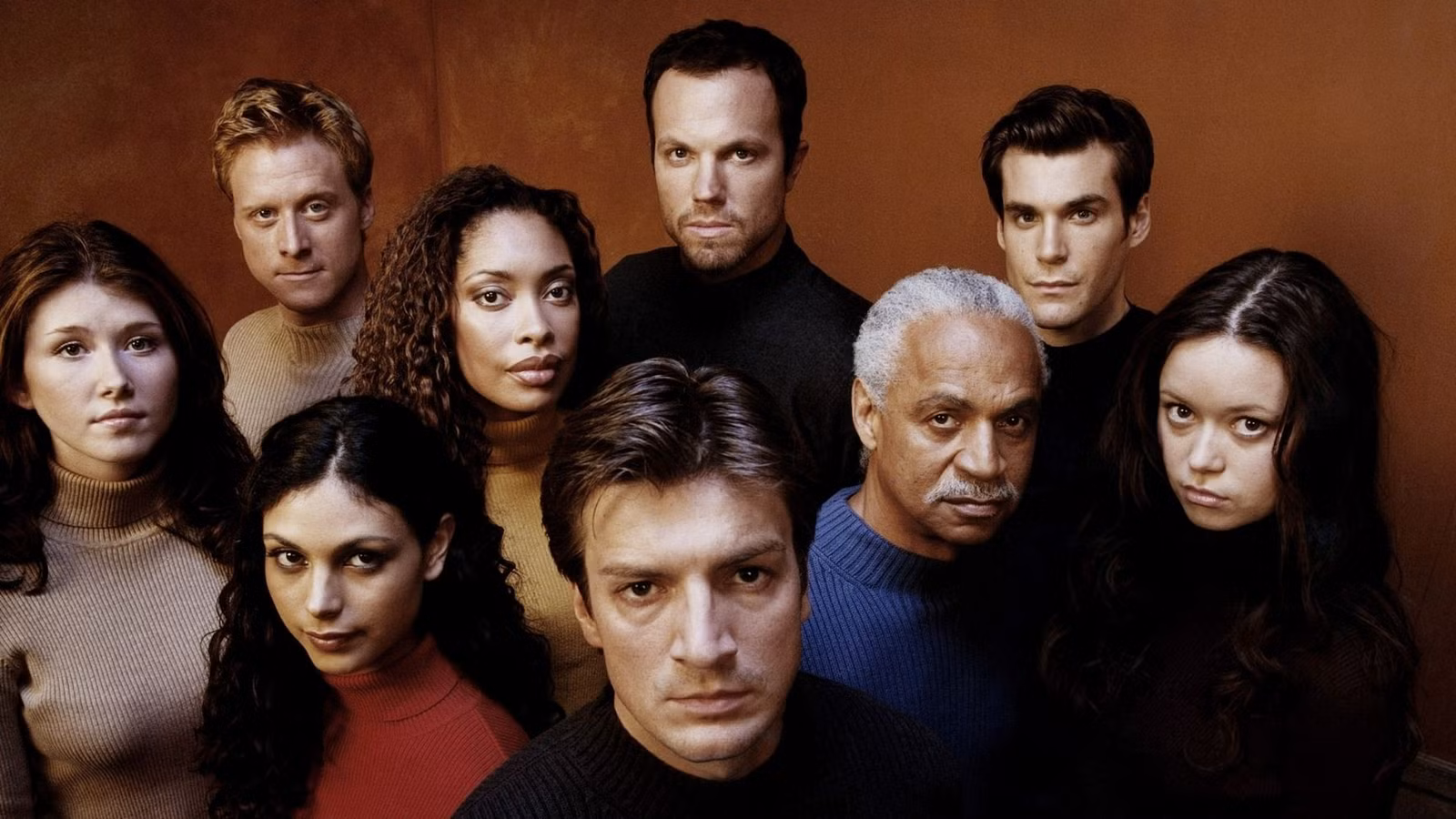 FIREFLY, from left, Jewel Staite, Alan Tudyk, Morena Baccarin, Gina Torres, Nathan Fillion, Adam Baldwin, Ron Glass, Sean Maher, Summer Glau, 2002-03. ph: Stewart Volland / TM and Copyright ©20th Century Fox Film Corp. All rights reserved / courtesy Everett Collection