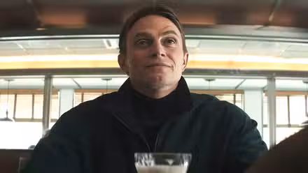 Bullseye (Wilson Bethel) in a diner with a milkshake in 'Daredevil: Born Again' Season 2, Episode 4
