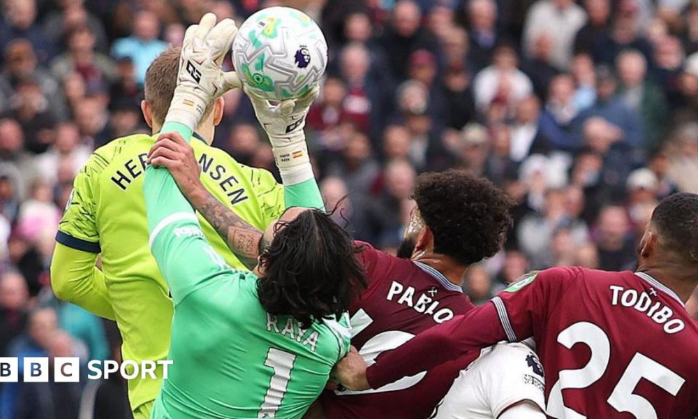 Pablo of West Ham United fouls David Raya of Arsenal before Callum Wilson scores a goal that is later disallowed following a VAR review