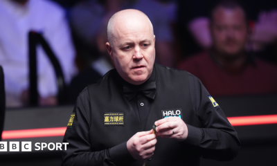 John Higgins lines up a shot