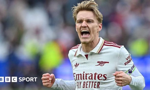Martin Odegaard celebrates Arsenal's win.