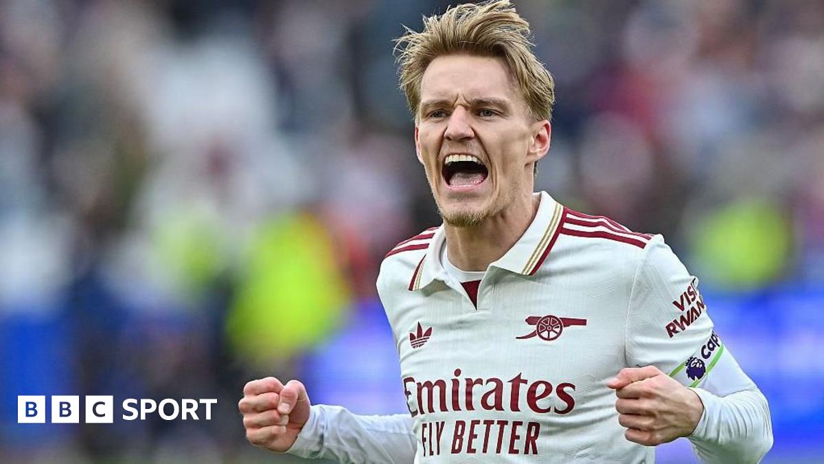 Martin Odegaard celebrates Arsenal's win.