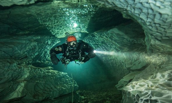 Elite divers begin perilous mission to find Maldives tourists lost in cave amid race to stop sharks scavenging remains