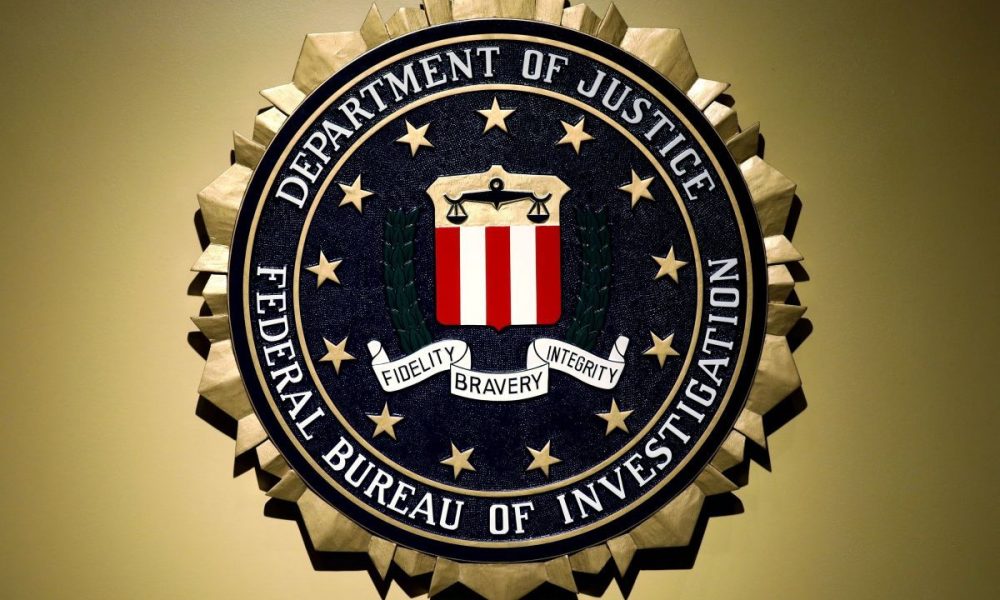 The Federal Bureau of Investigation seal is seen at FBI headquarters before a news conference by FBI Director Christopher Wray on the U.S Justice Department's inspector general's report regarding the actions of the Federal Bureau of Investigation and the