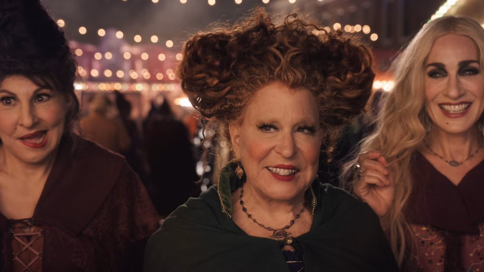 Kathy Najimy, Bette Midler, and Sarah Jessica Parker wickedly smiling in Hocus Pocus 2